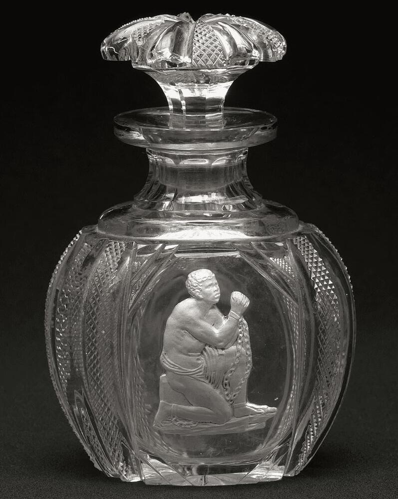 A slave in chains etched into a glass bottle