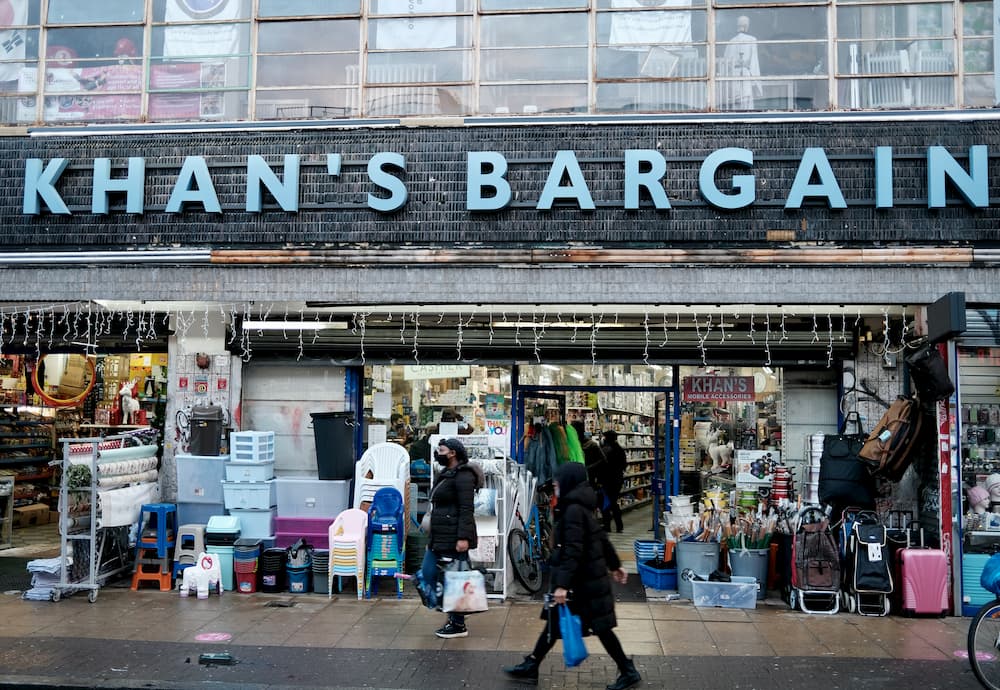 A shop front with a sign reading Khan’s Bargains