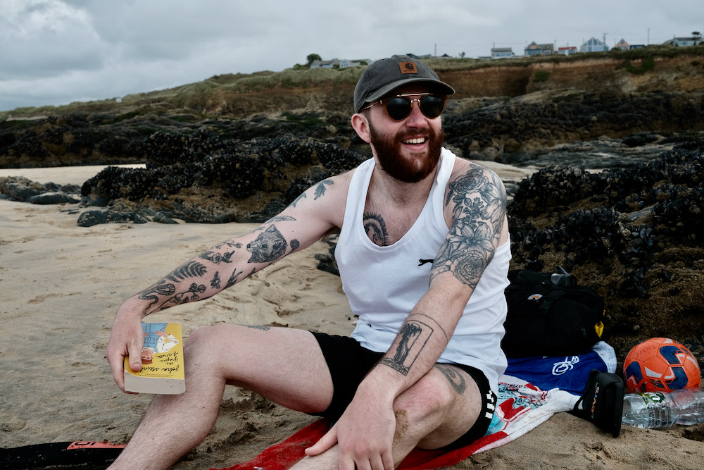 A man smiling on the beach