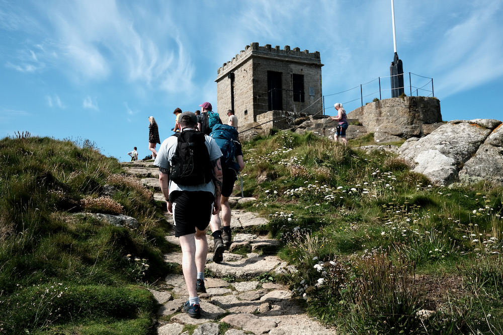 Hikers climbing up to a fort