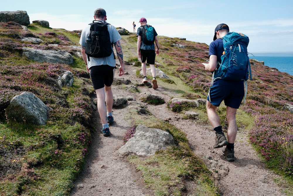 A group of hikers climbing a hill