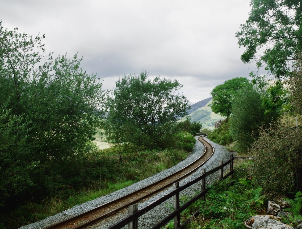 A railway snaking through a green valley