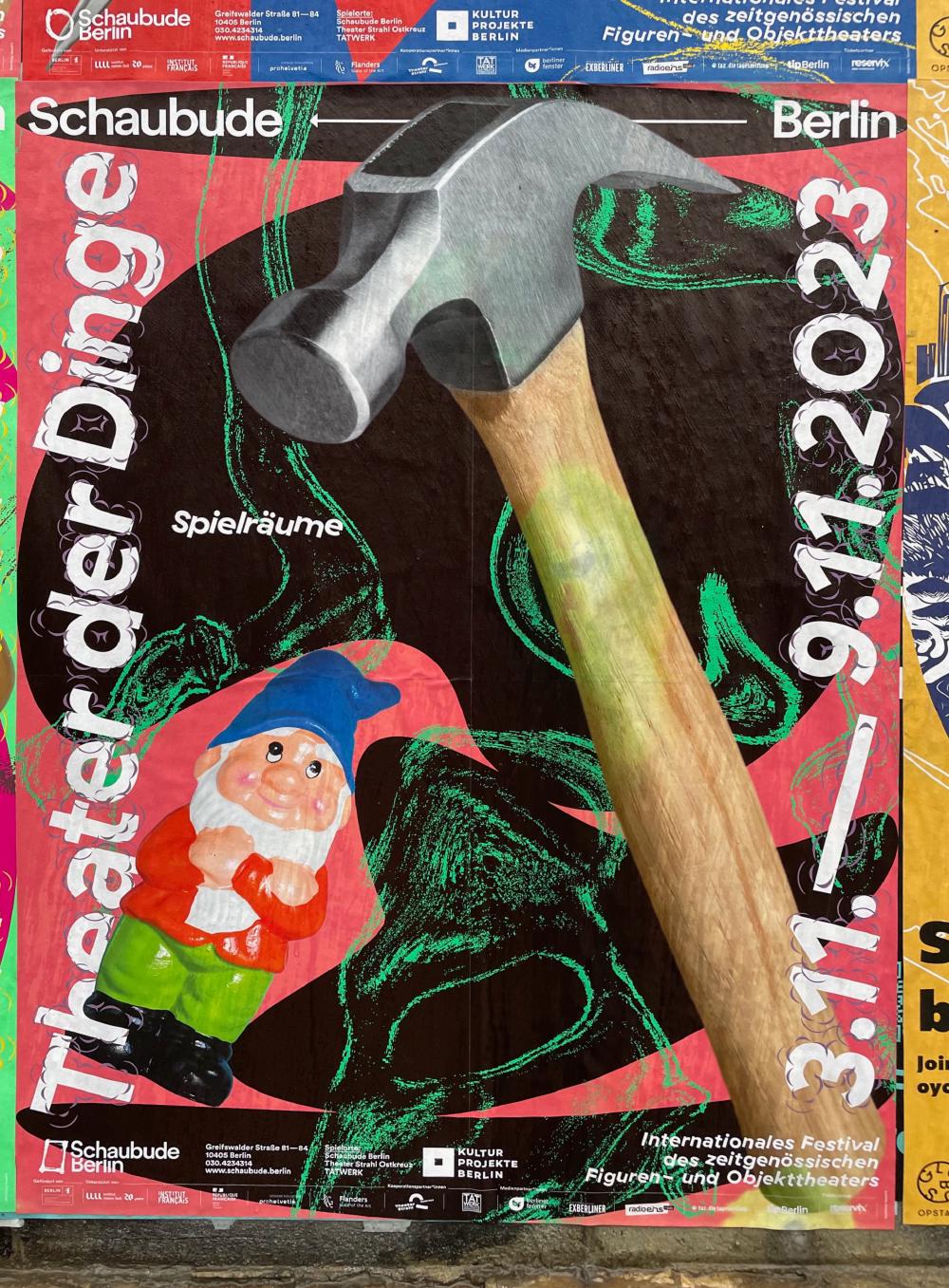 Hammer and garden gnome on a poster for the Theater of Things