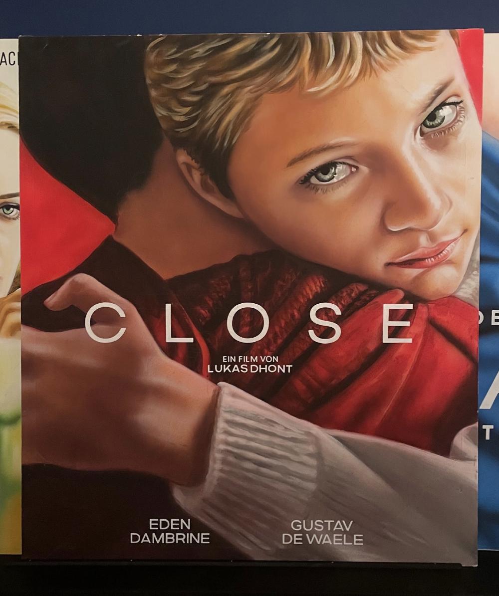 Close, a film by Lukas Dhont. A painting of a boy hugging another.