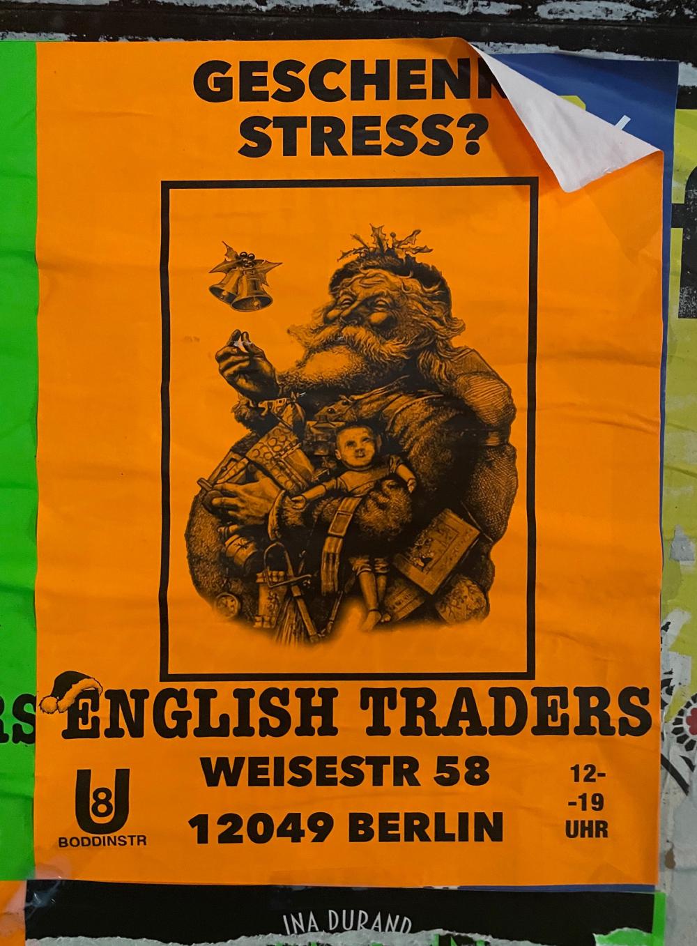 Orange poster for English Traders featuring old illustration of Santa Claus